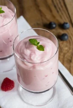 Raspberry cream dessert with mint Stock Photos