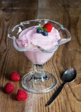 Raspberry cream dessert with mint Stock Photos