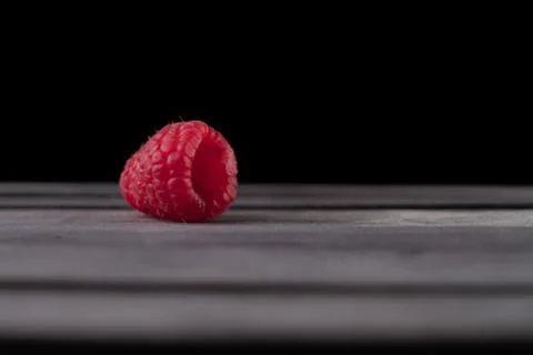Raspberry on a dark wooden background Foto stock