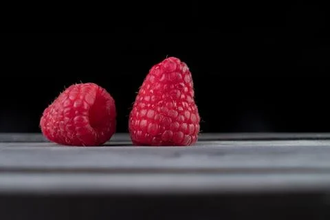 Raspberry on a dark wooden background Foto stock