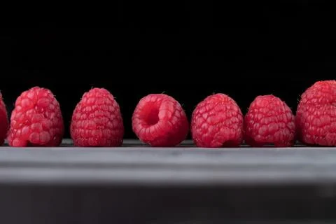 Raspberry on a dark wooden background Foto stock