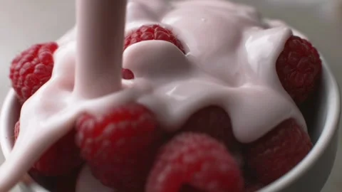 Raspberry Delight: Cup of Raspberries with Cream Stock Footage 277809383