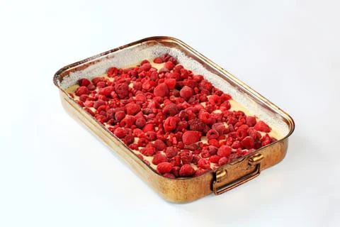 Raspberry dessert in a metal baking dish Stock Photos