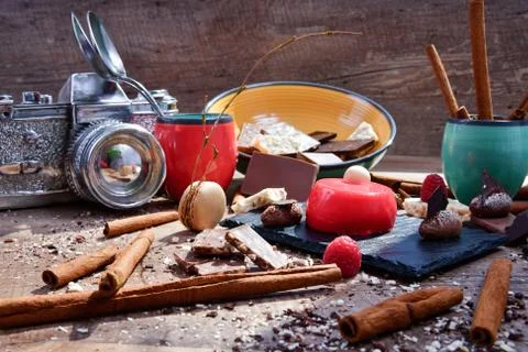 Raspberry dessert surrounded by assorted chocolate sweets Stock Photos