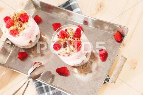 Raspberry desserts on a metal tray Stock Photos