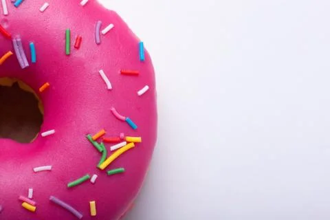 Raspberry donut with icing on a white background. Top view with copy space Stock Photos