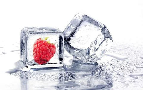 Raspberry frozen in ice cube. two ice cube Stock Photos