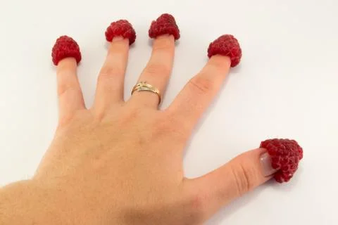 Raspberry in hand Stock Photos