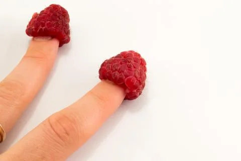 Raspberry in hand Stock Photos