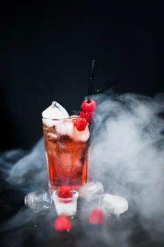 Raspberry ice cold refreshing cocktail with berries. Flat lay, Front view. Sm Stock Photos