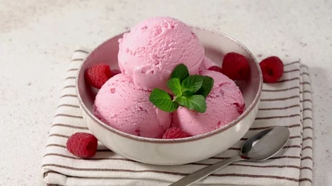 Raspberry ice cream in a plate Stock Footage 266587194