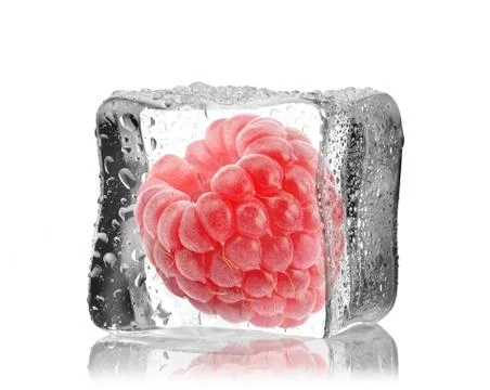 Raspberry in ice cube Stock Photos