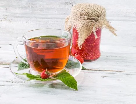 Raspberry jam and tea in cup Stock Photos
