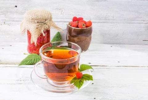 Raspberry jam and tea in cup Stock Photos