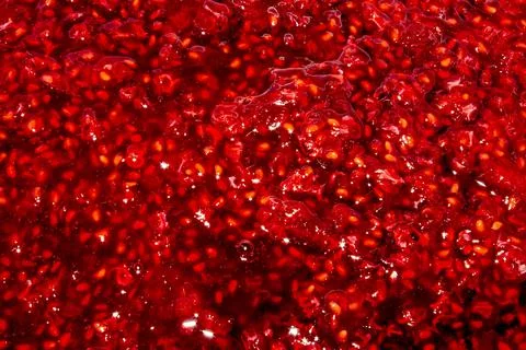 Raspberry jam background.Raspberries in sugar.The texture of raspberry jam. Stock Photos