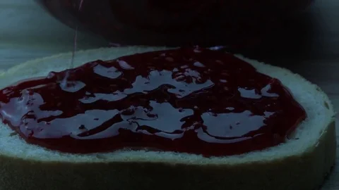 Raspberry jam on bread slice Stock Footage 84048019