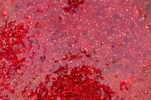 Raspberry jam close-up as background. Texture of grated raspberries. Stock Photos