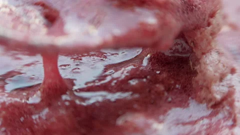 Raspberry jam foam. Mixing the sweetness with a spoon. Stock Footage 142093184