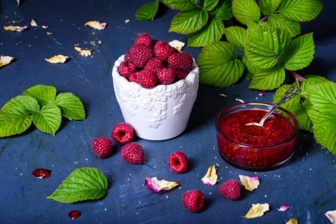 Raspberry jam with fresh berries, close up, copy space. Stock Photos