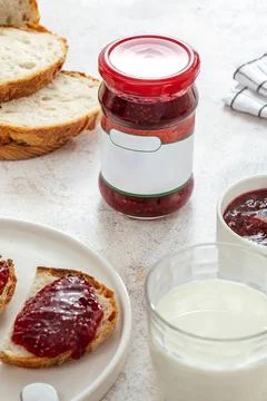 Raspberry jam in a jar. bread with jam on a plate Stock Photos