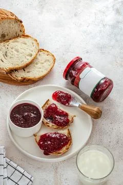 Raspberry jam in a jar. bread with jam on a plate Stock Photos