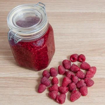 Raspberry jam in jar isolated Stock Photos