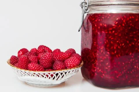 Raspberry jam in jar isolated Foto stock