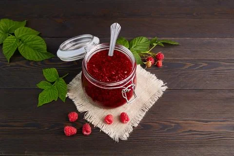 Raspberry jam in a jar Stock Photos