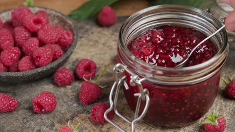 Raspberry jam , marmalade or confiture in a jar with fresh berries Stock Footage 218461242