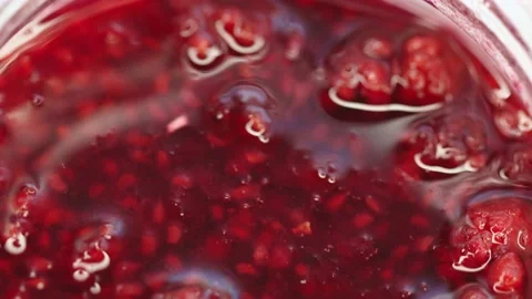 Raspberry jam rotates in a circle. High quality 4k footage Stock Footage 219938084