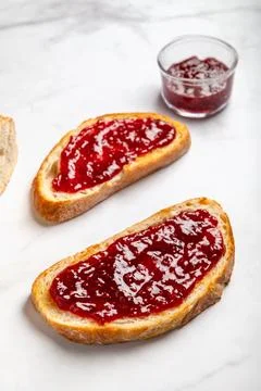 Raspberry jam on toast Stock Photos