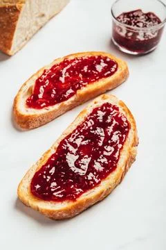 Raspberry jam on toast Stock Photos