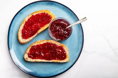 Raspberry jam on toast Stock Photos