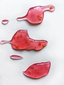 Raspberry jelly on a white background Stock Photos