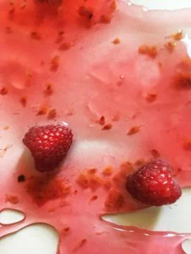 Raspberry jelly on a white background Stock Photos