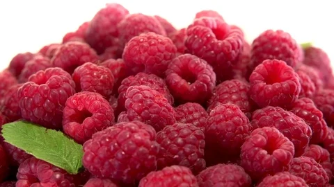 Raspberry. Juicy fresh Raspberry on a white background rotates. Video stock 77689730
