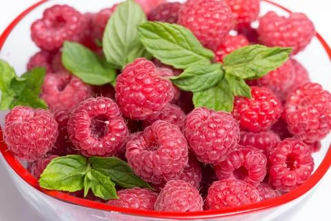 Raspberry with leaves isolated on white background. Stock Photos