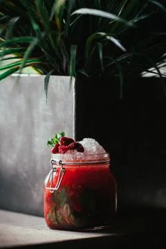 A raspberry lemonade sitting on a table Foto stock