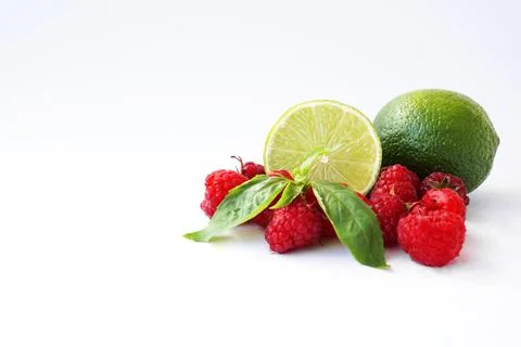 Raspberry, lime and basil on a white background Foto stock