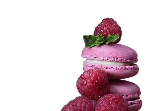 Raspberry macaron with raspberry pieces on a white background Stock Photos