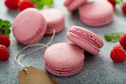 Raspberry macarons on gray table Stock Photos