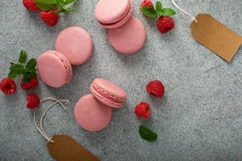 Raspberry macarons on gray table Stock Photos