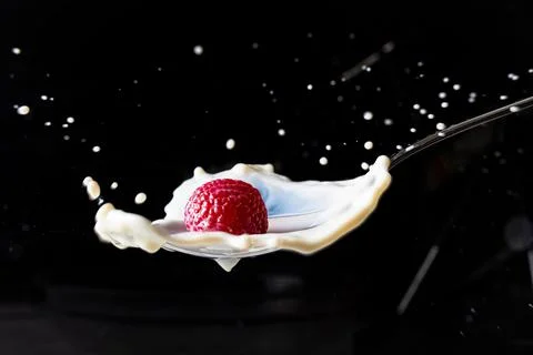 Raspberry milk splash Stock Photos