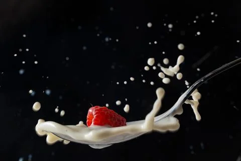Raspberry milk splash Stock Photos