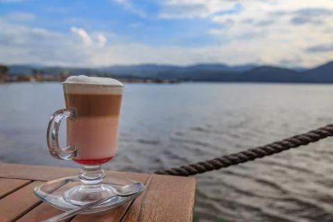 Raspberry mocha on the table with beach view Stock Photos