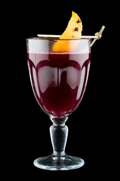 Raspberry mulled wine with orange peel. On dark background. Warming drink. 스톡 사진