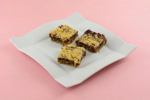 Raspberry oat crumble square dessert Stock Photos