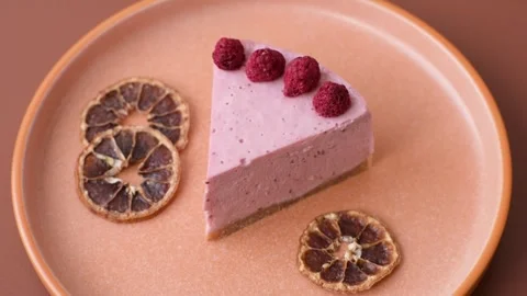 Raspberry or strawberry cheesecake, a slice of sweet red cake with berries. Rasp Stock Footage 321244189
