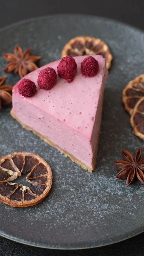 Raspberry or strawberry cheesecake, a slice of sweet red cake with berries. Rasp Stock Footage 321244199