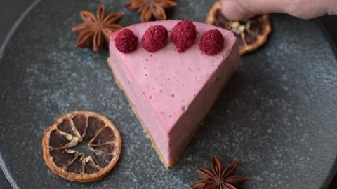 Raspberry or strawberry cheesecake, a slice of sweet red cake with berries. Rasp Stock Footage 321244206